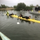 School pupils on upturned hull