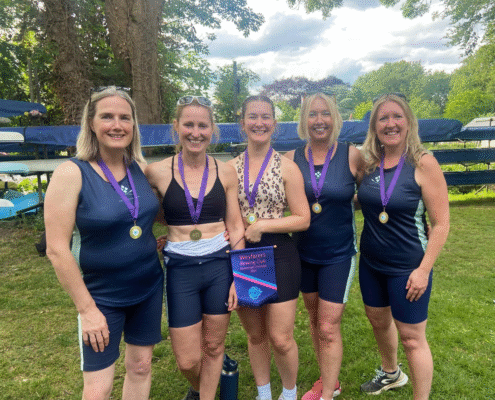 Five ladies with medals from winning rowing event