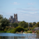 View of rowing crews with Ely cathedral in the background